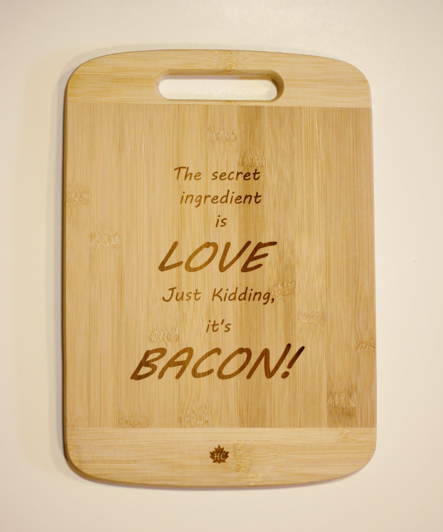 Bamboo cutting board "The Secret Ingredient Is Love, Just Kidding It's Bacon"